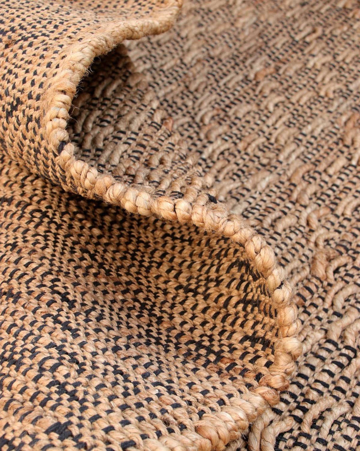 Folded drape showing the resilient handwoven flatweave. Ethically handmade in Bhadohi and GoodWeave certified.