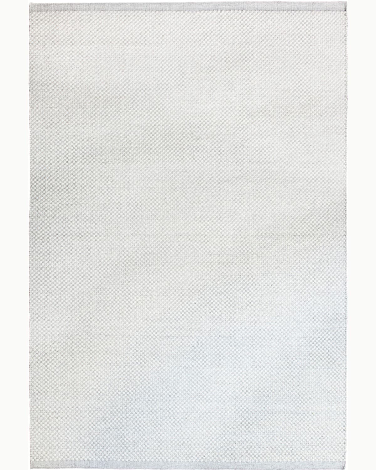 House of Bohi Bindi ivory wool area rug featuring a handwoven flatweave with a fine, beaded texture.