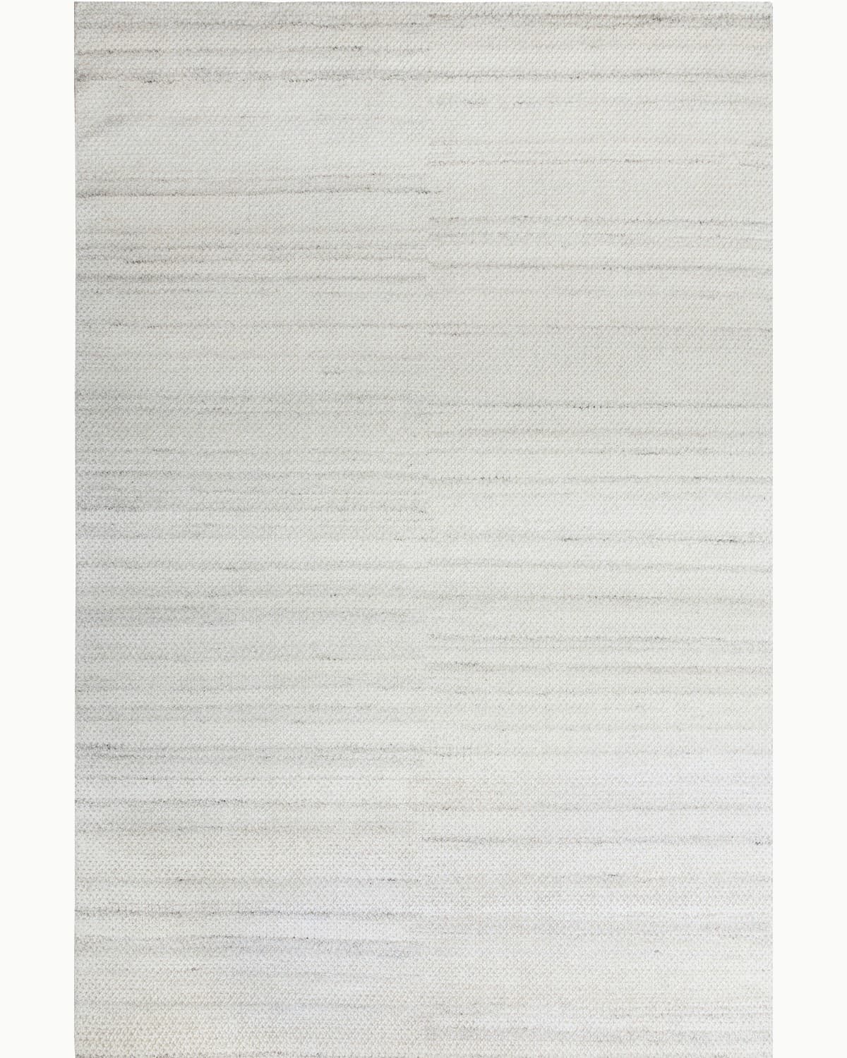 House of Bohi Fida area rug in mist, featuring a handknotted wool construction with a quiet grid pattern.
