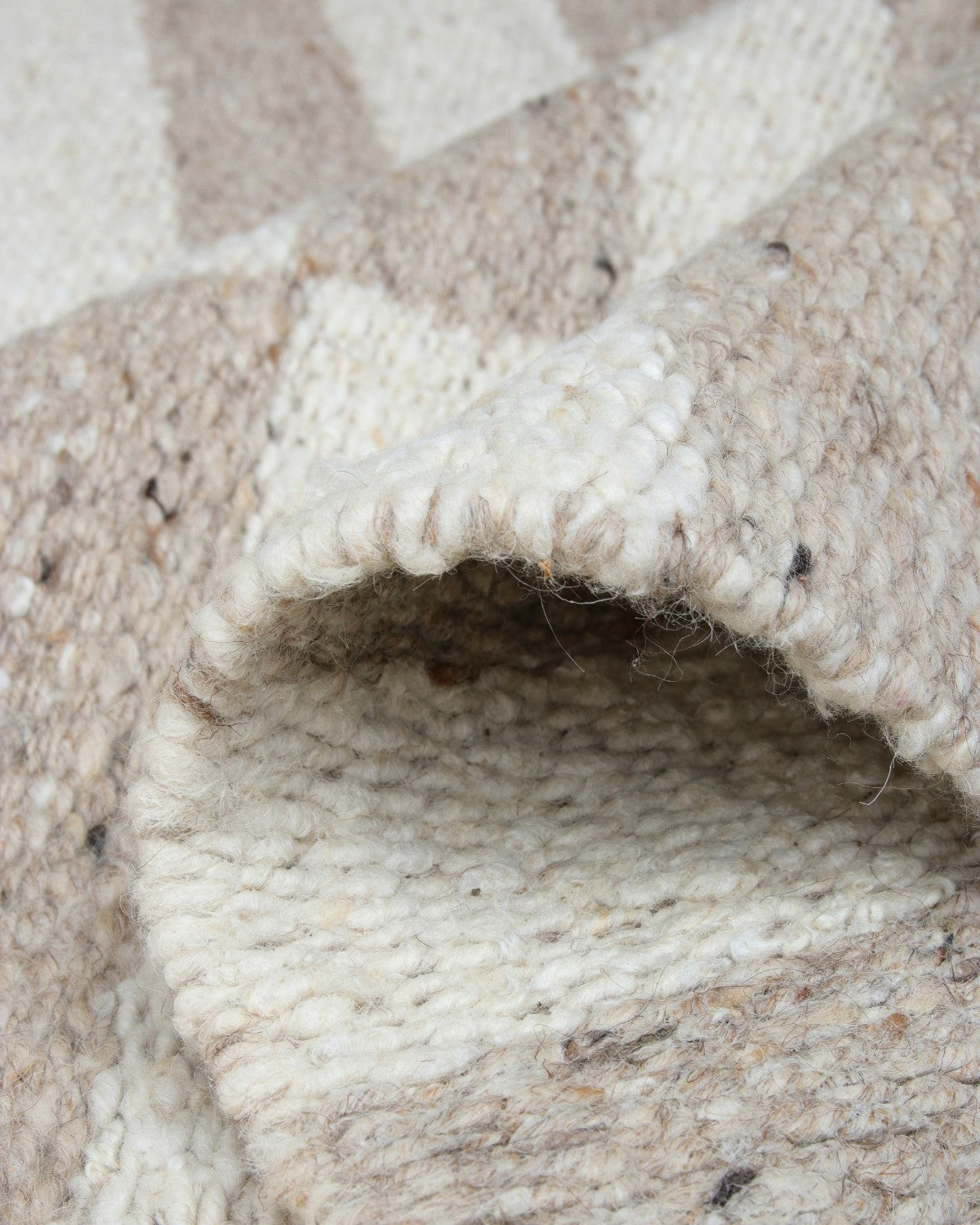 A close look at the folded corner finishing of this GoodWeave certified, 12mm pile runner, ideal for a serene bedroom space.