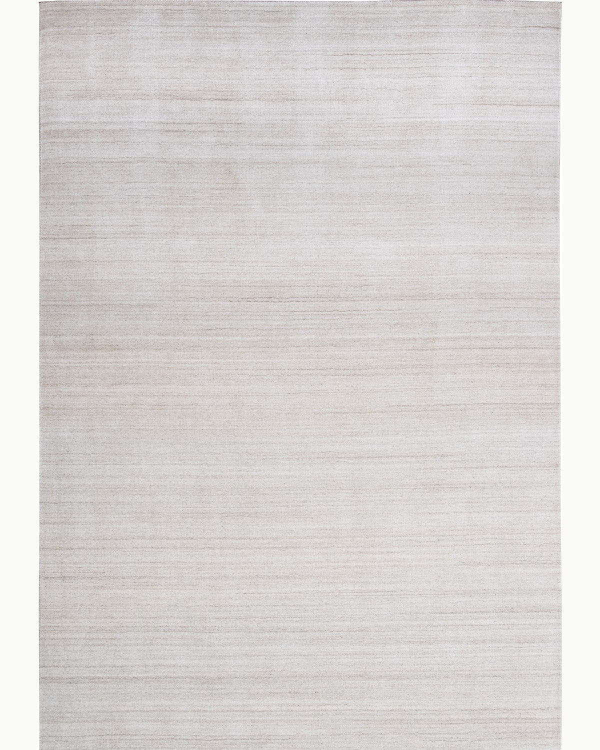House of Bohi Loma handloomed wool and viscose area rug in beige, showcasing a full overhead view of its organic striations.