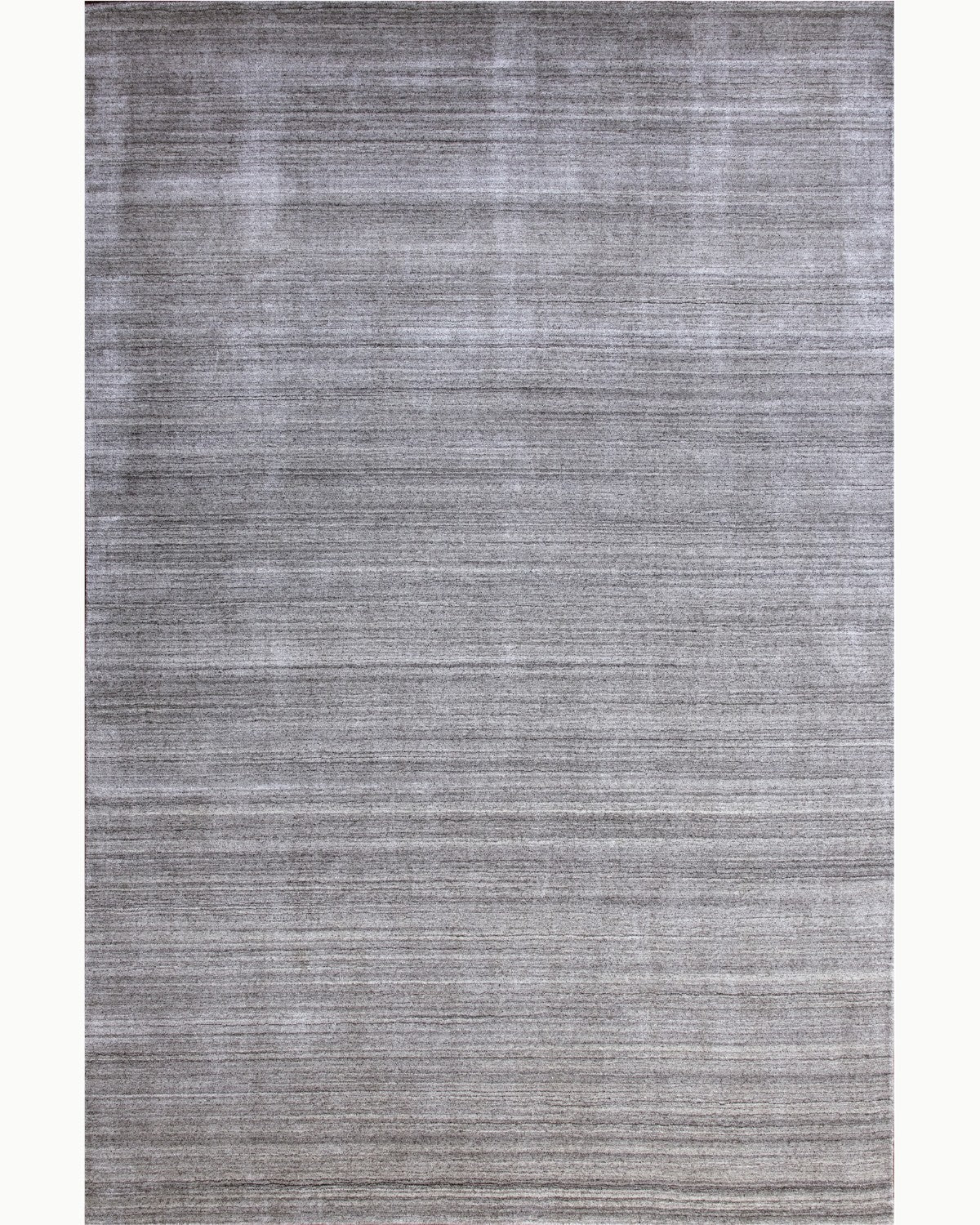 House of Bohi Loma handloomed wool and viscose area rug in silver grey, showing a full overhead view of its organic rhythm.