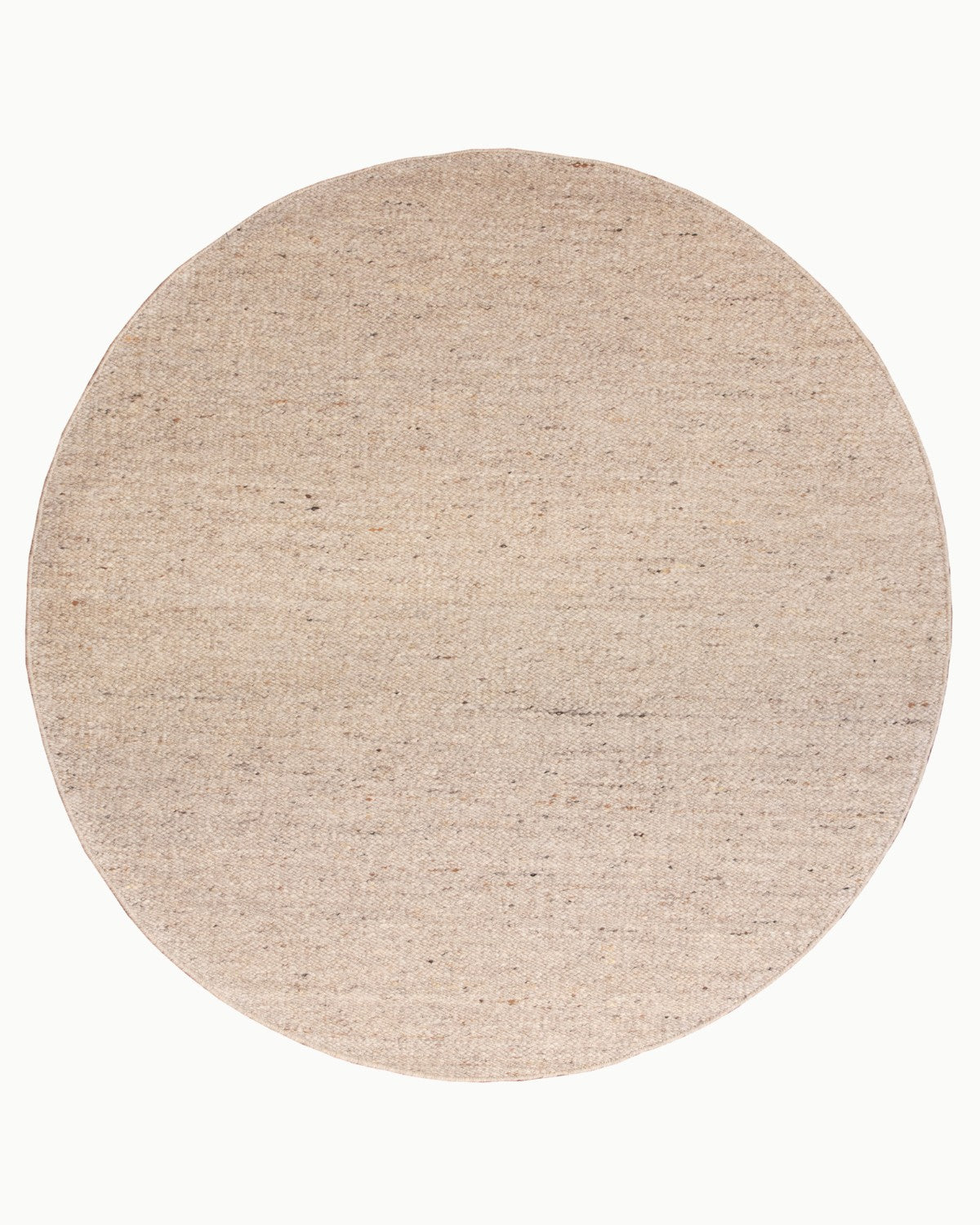 Overhead view of the circular variation, bringing grounded warmth and quiet character to a cozy bedroom.