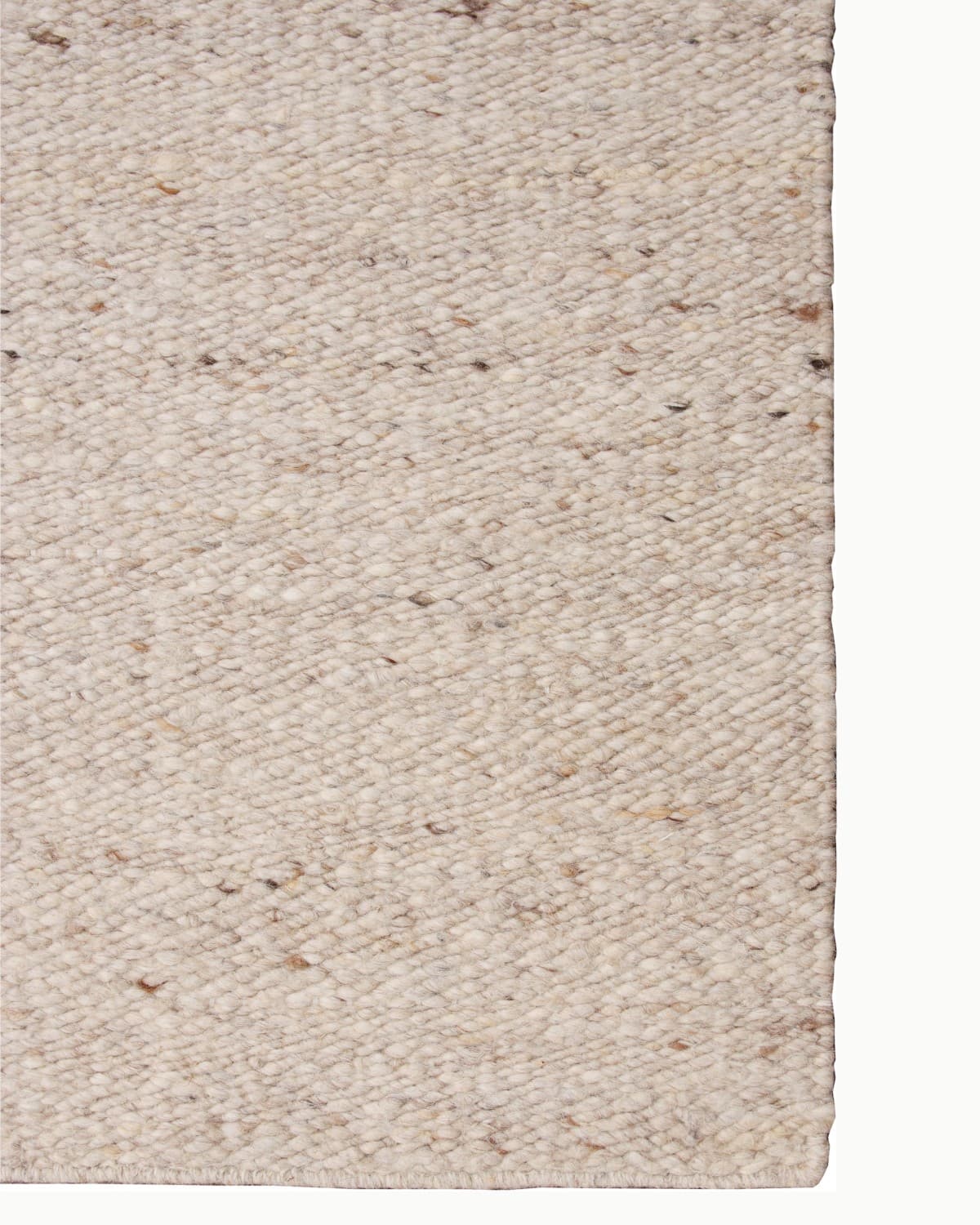 Detailed view of the neat side binding on this ethically handmade, GoodWeave certified Indian floor piece.