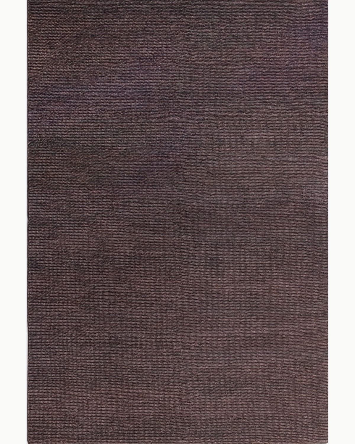 House of Bohi Nari area rug in chocolate. A full overhead view of this handwoven jute rug showcasing its rich brown tones.