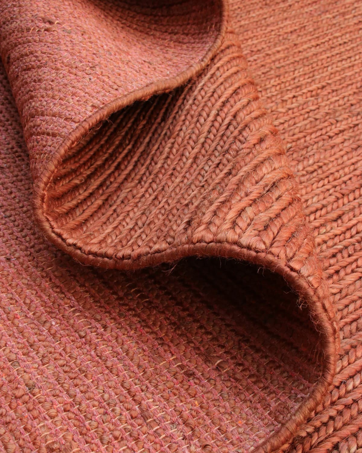 A simple fold showing the underside of this GoodWeave certified flatweave, an earthy anchor for a living room or bedroom.