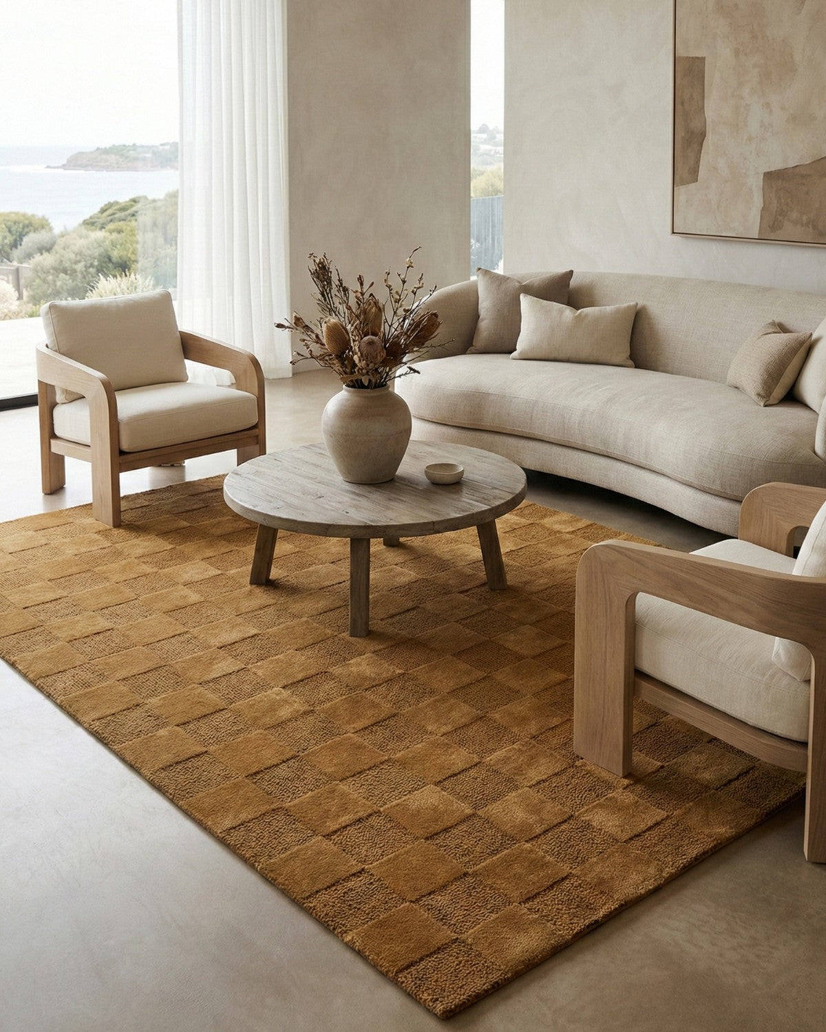 Styled in an organic modern living room, this hand-tufted area rug provides an architectural yet warm tactile anchor.
