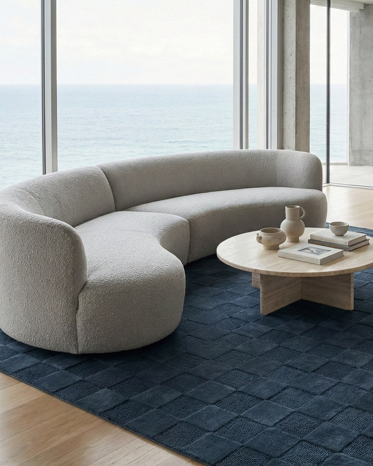 Resting under a round coffee table, alternating squares of plush cut pile and loop weave create a rhythmic interplay.