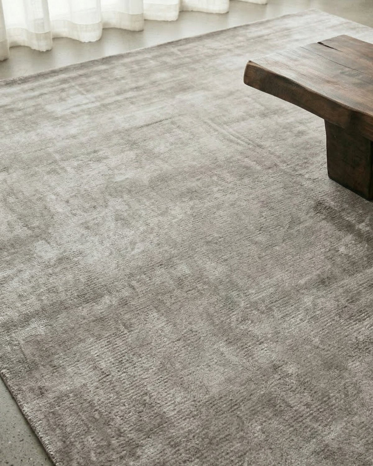 Luxurious light grey flooring suitable for a bedroom or dining room, offering a luminous calm and soft feel.
