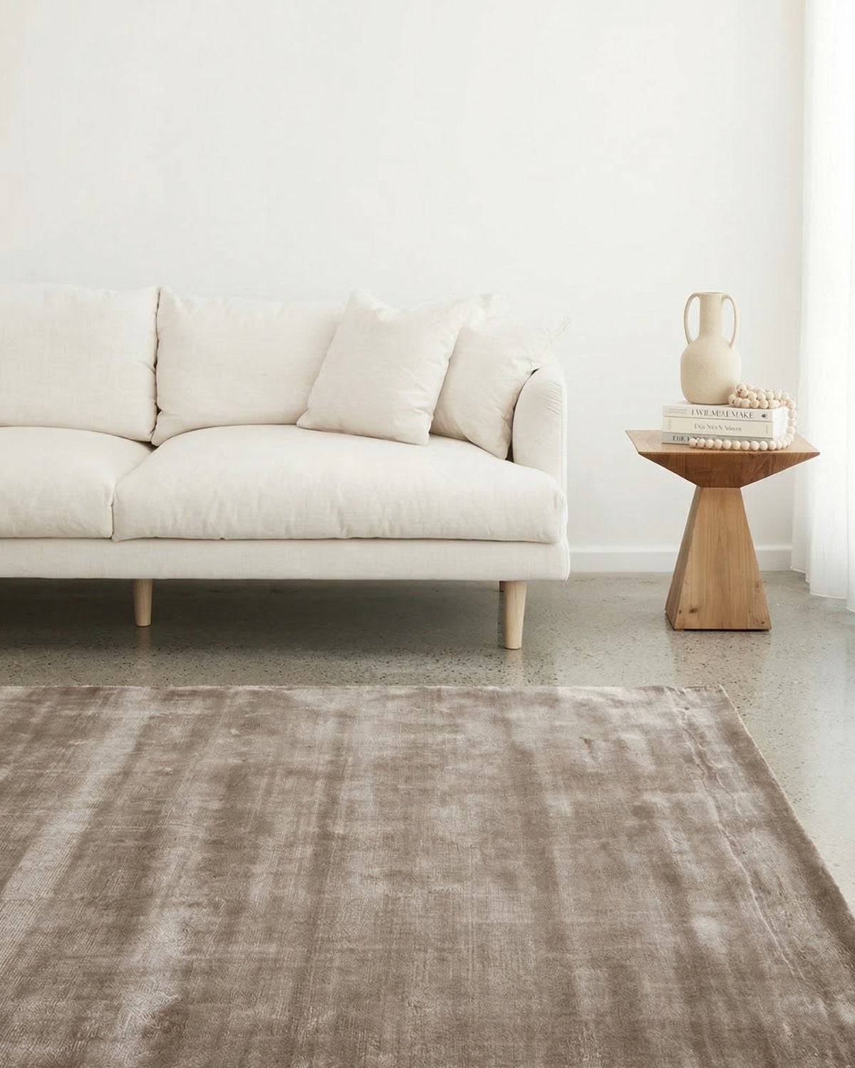 Velvety dense cut pile flooring styled in a living room, bringing quiet, intentional elegance to the modern space.