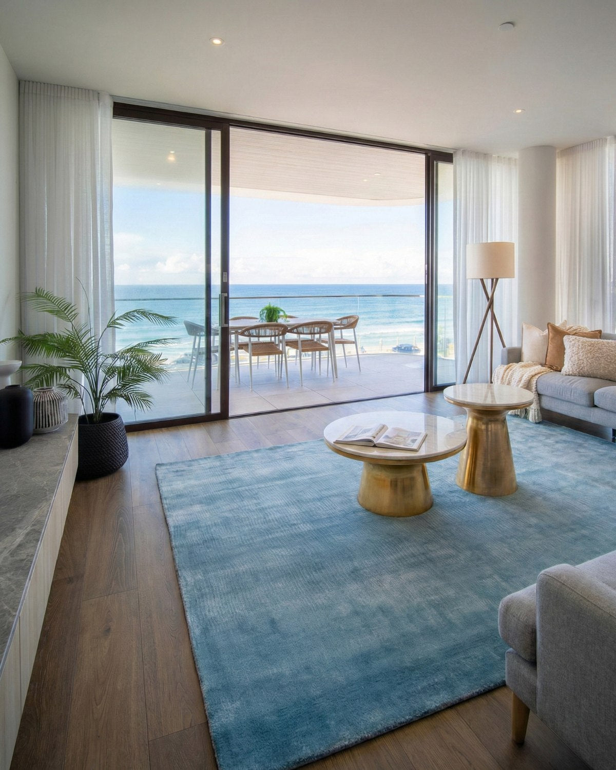 Dense cut pile flooring styled in a bright living room, providing quiet, intentional elegance with its velvety texture.