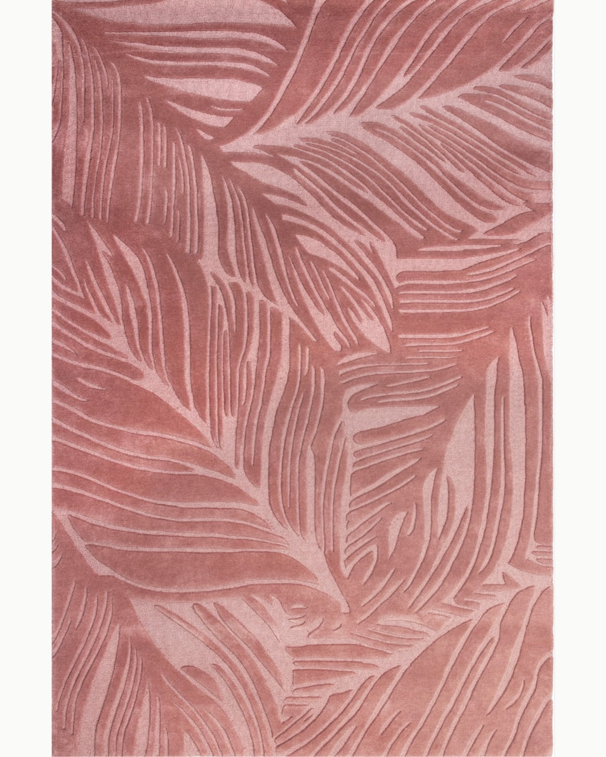 House of Bohi Sway area rug in rosewood. Hand-carved leaf design in premium New Zealand wool for a rhythmic, organic presence.