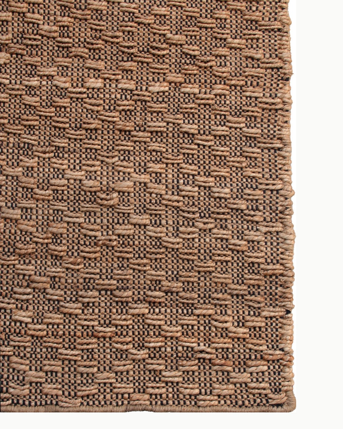 Top-down corner detail showing the clean edge finish and 12mm pile height, adding rustic warmth to a living room or bedroom.