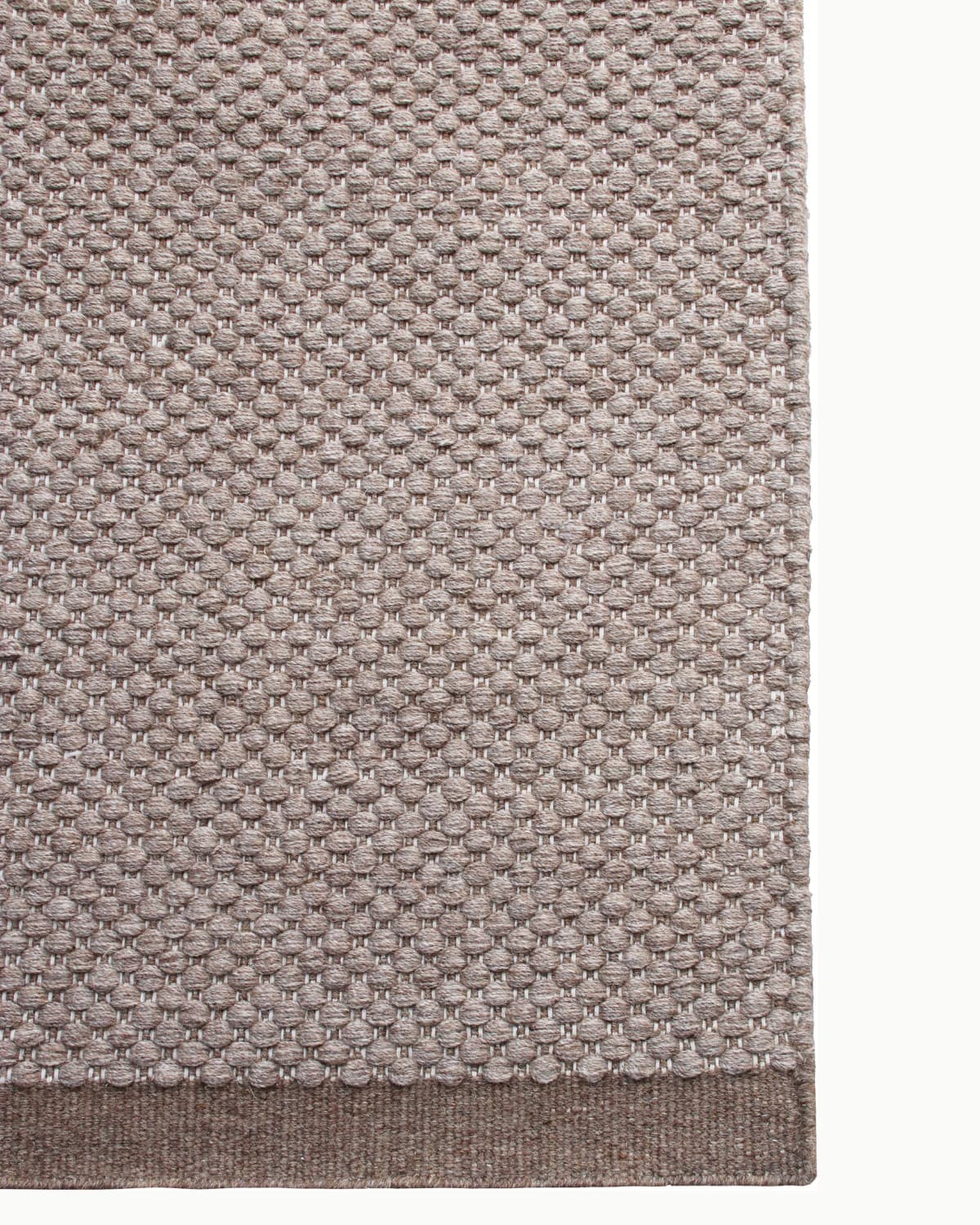 Top-down view of the durable corner finish, perfectly suited for a dining room or bedroom. GoodWeave certified.
