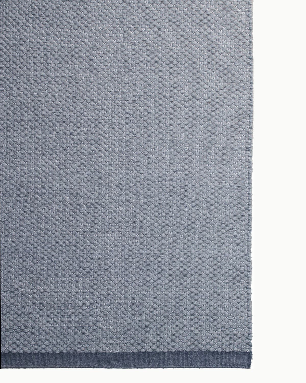 Durable corner finish perfect for a dining room or bedroom. Handmade in Bhadohi and GoodWeave certified.