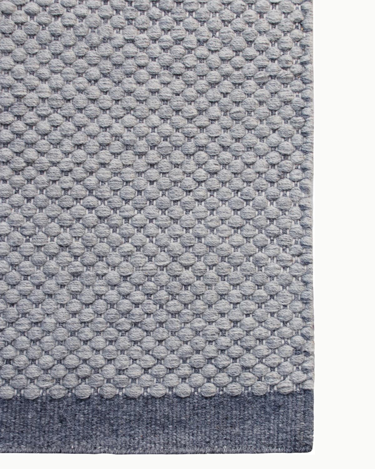 Durable corner finish providing a calm foundation for a living room or bedroom. GoodWeave certified ethical production.