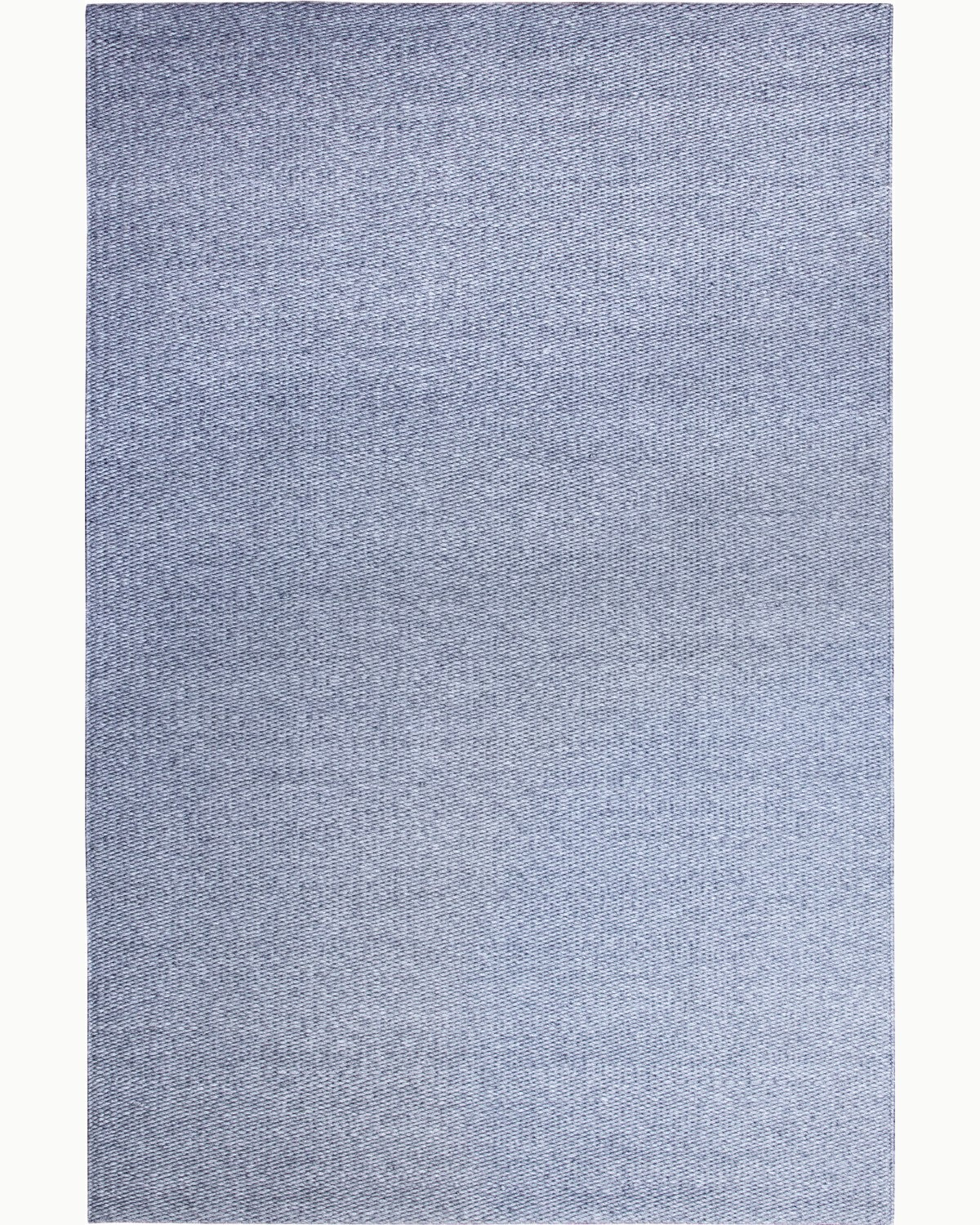 Full overhead view displaying the calm, linear rhythm and plush 15mm pile height for a timeless living room anchor.