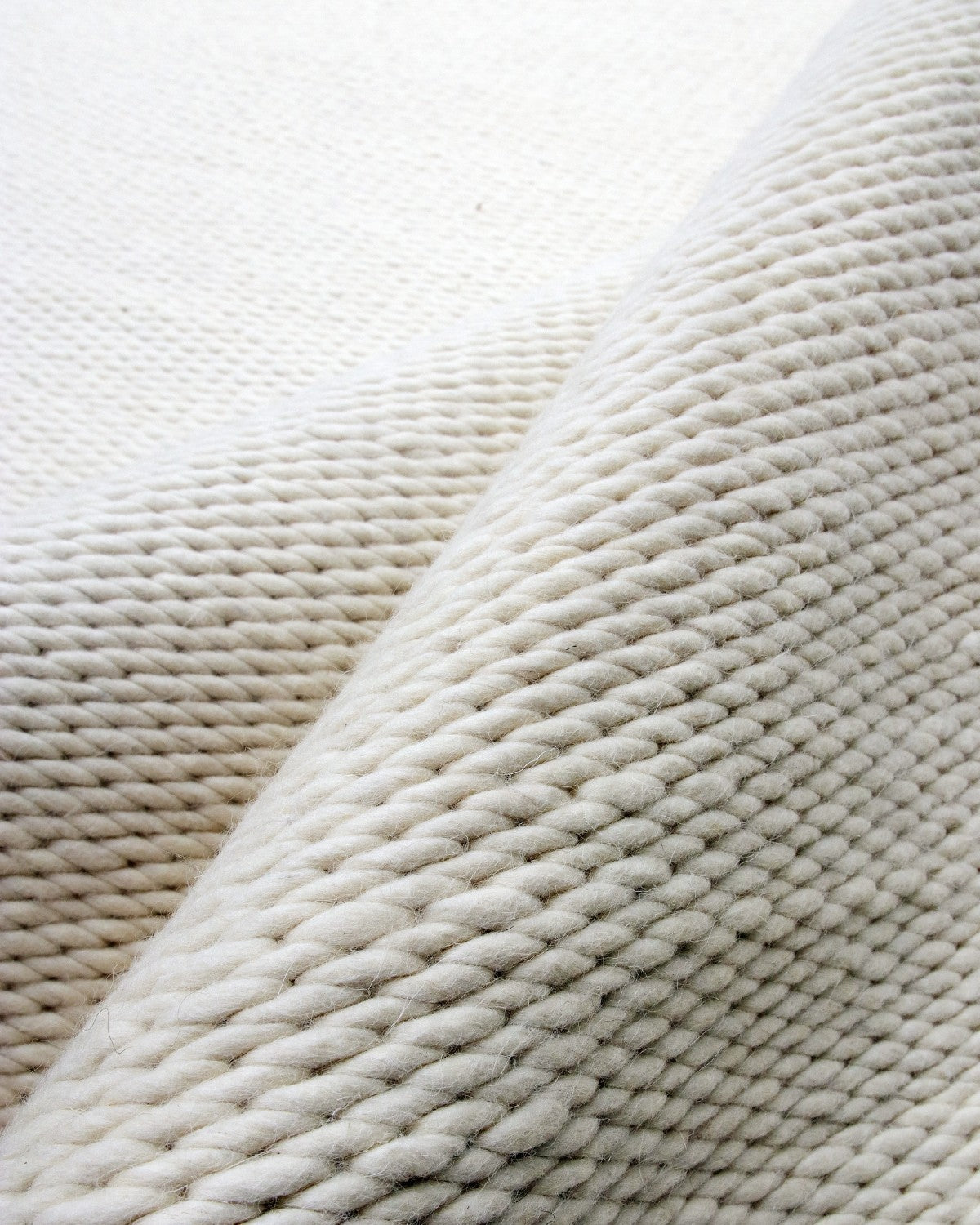 House of Bohi Buna ivory wool area rug showcasing a thick, handwoven flatweave constructed from premium undyed yarn.