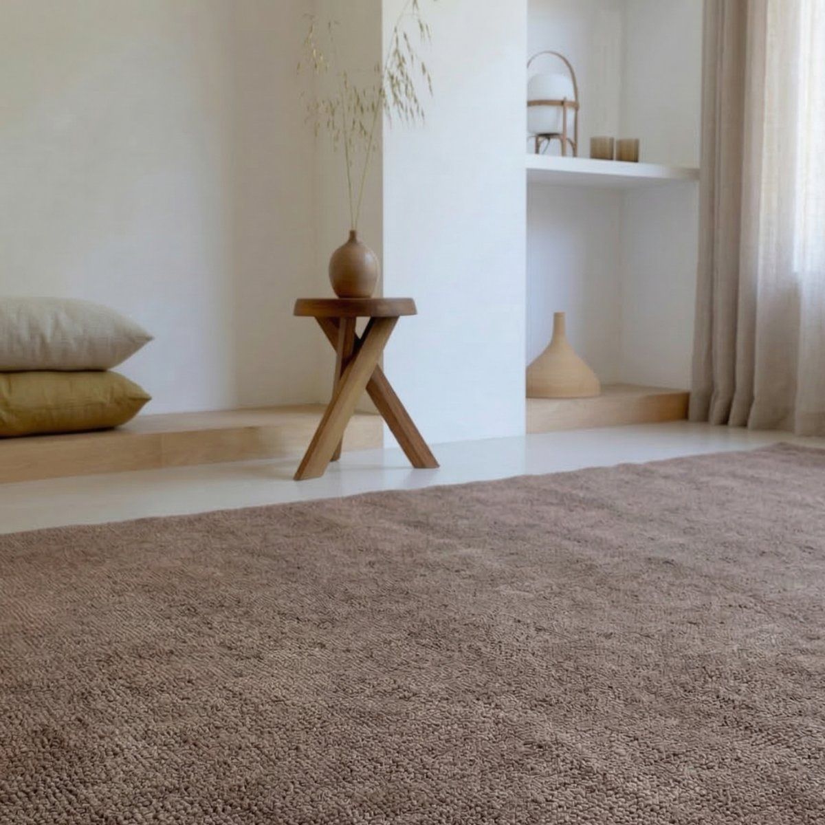 House of Bohi Raya Wool Rug in mushroom with a taupe colour tone styled in a warm neutral contemporary living room.