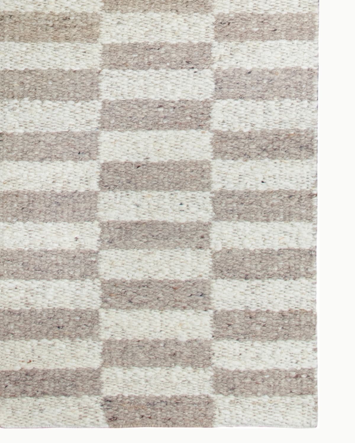 Handwoven flatweave revealing rhythmic offset blocks and broken stripes, an earthy design ideal for an entryway or hallway.