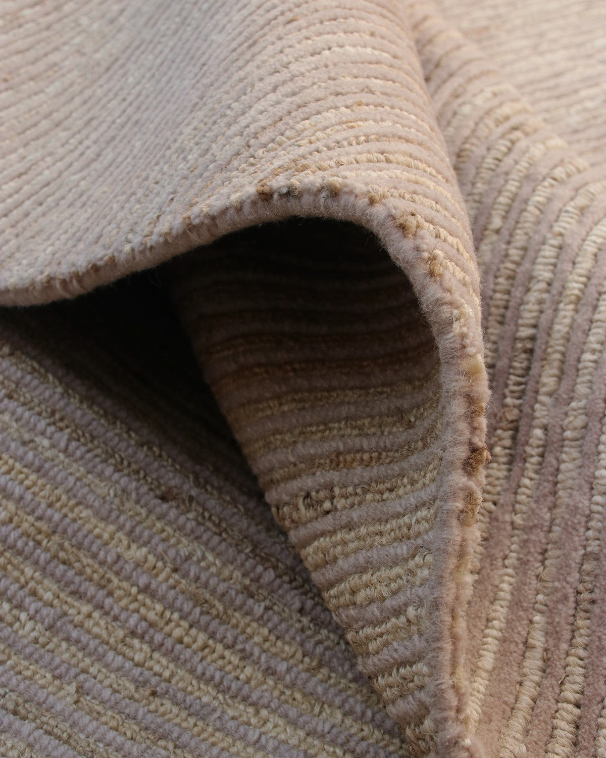 A folded view revealing the 15mm pile height and resilient back, ideal for bringing calm to a living room or bedroom.