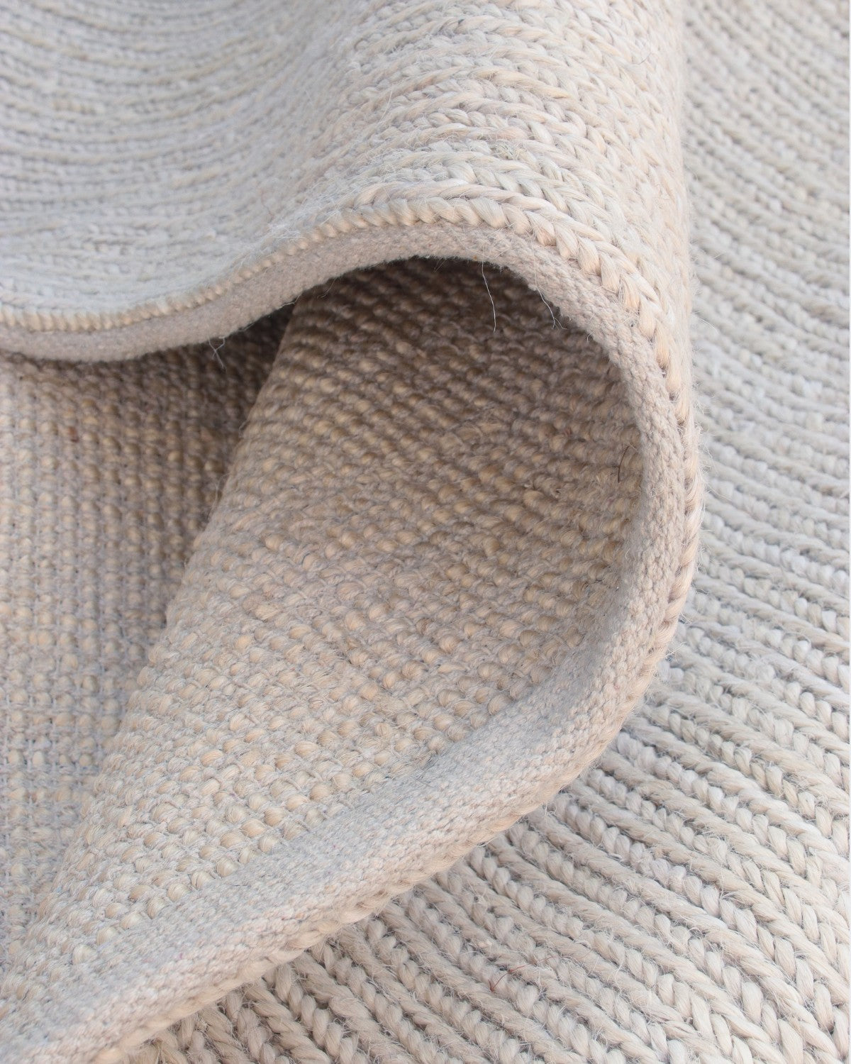 A soft drape highlights the resilient 12mm pile, making this earthy anchor an ideal foundation for a living room or bedroom.