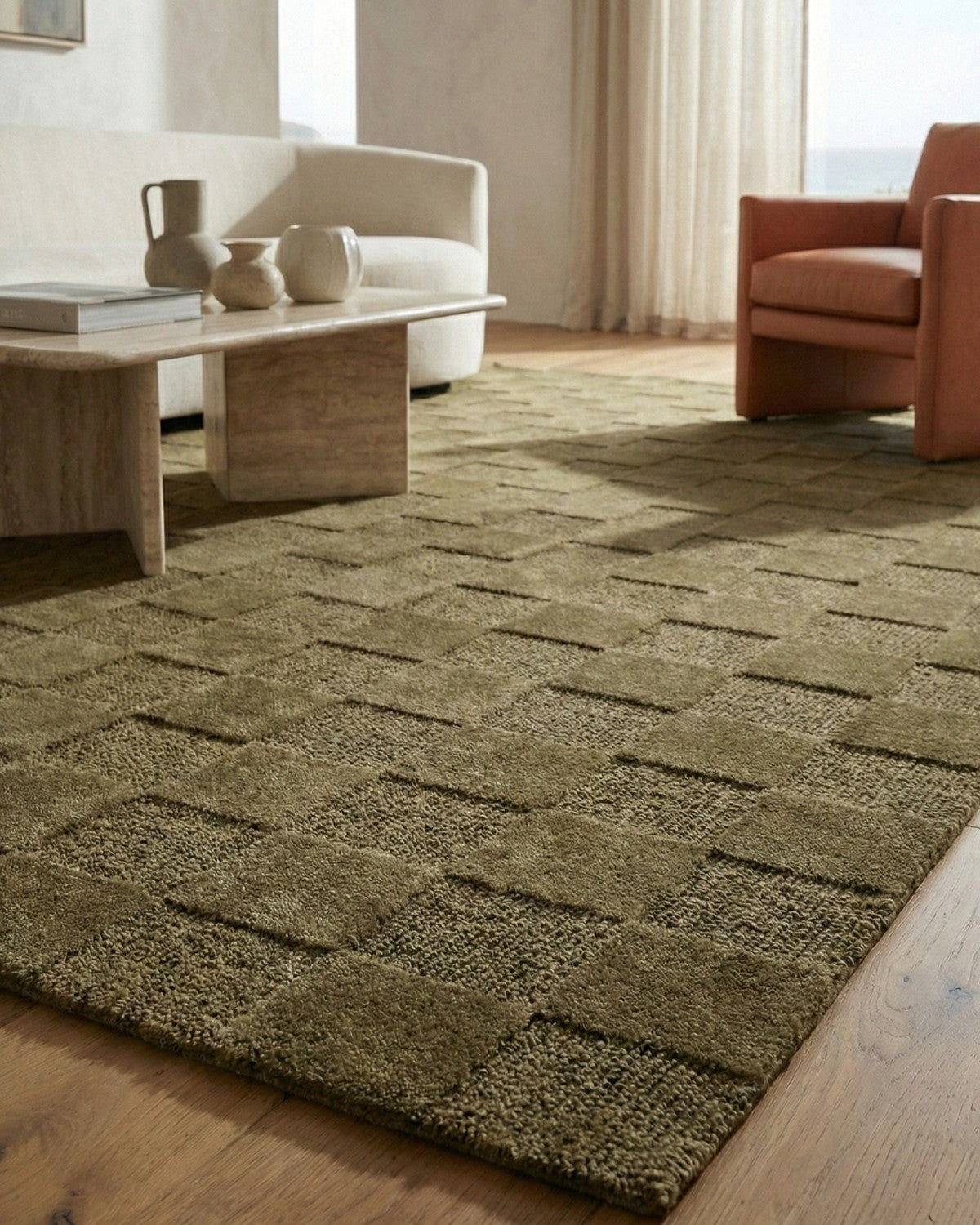 Bringing architectural restraint to the floor, alternating squares of plush cut pile and loop weave create rich depth.