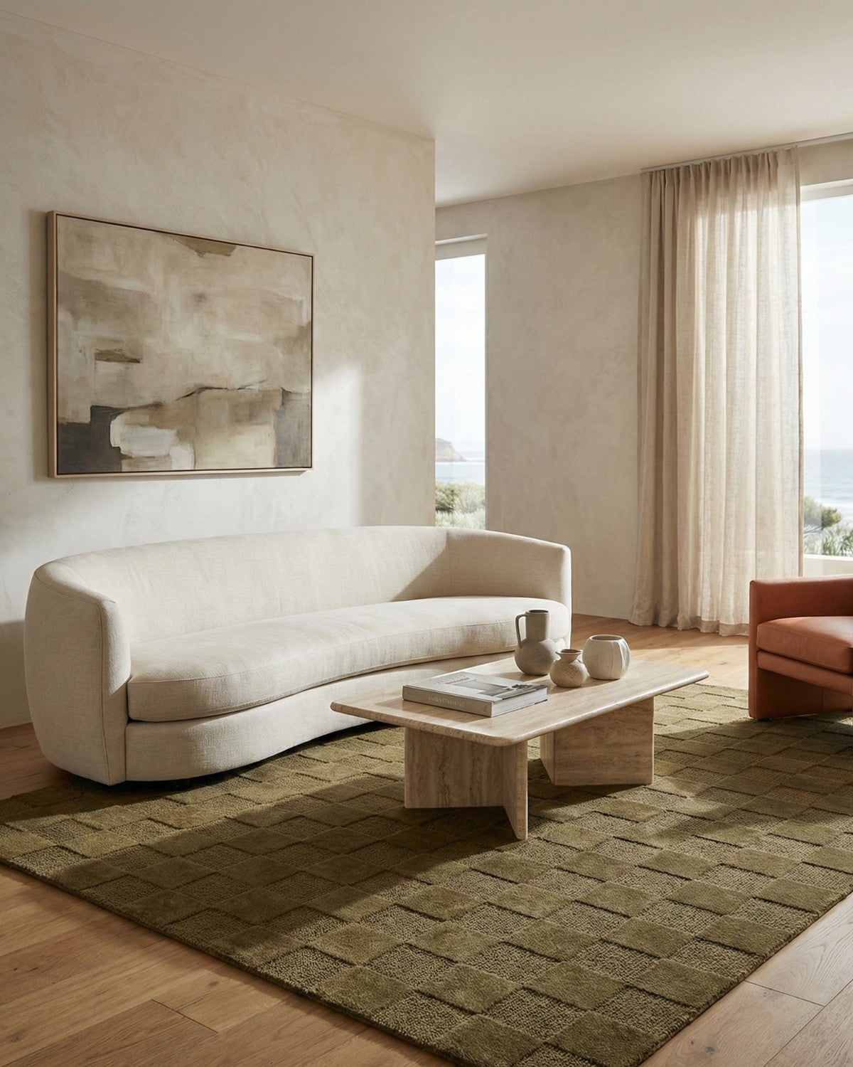 Styled in a serene living room, this hand-tufted rug offers a balanced tactile anchor with organic warmth.