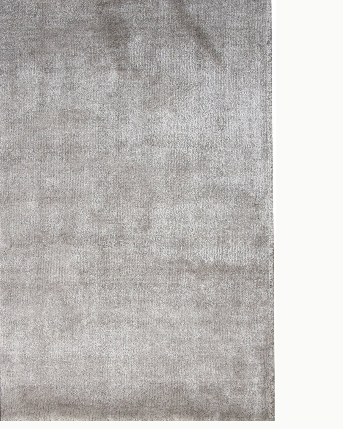 Flat view of an ethereal light grey area rug perfect for a study, highlighting the subtle variations and smooth finish.