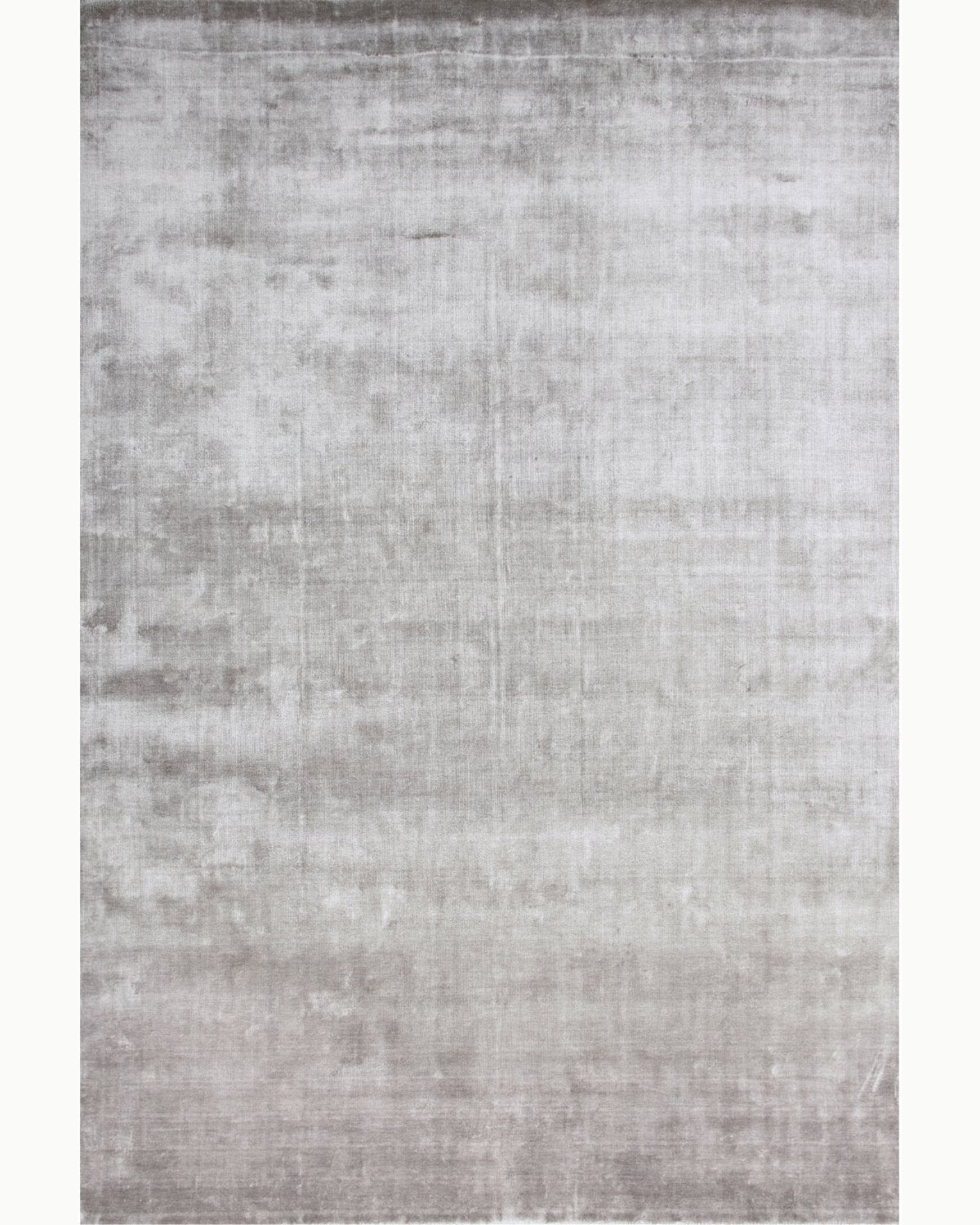 House of Bohi Noor light grey area rug in silky Tencel, featuring a luminous sheen and understated opulence.
