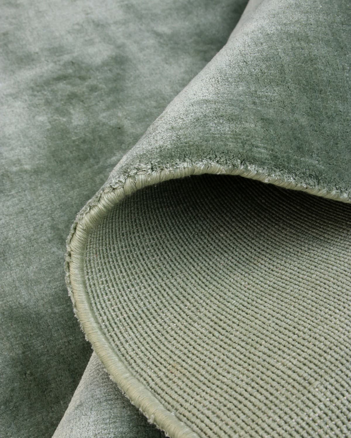 Folded corner revealing the dense construction and soft sheen, ideal for bringing calm to a peaceful study.
