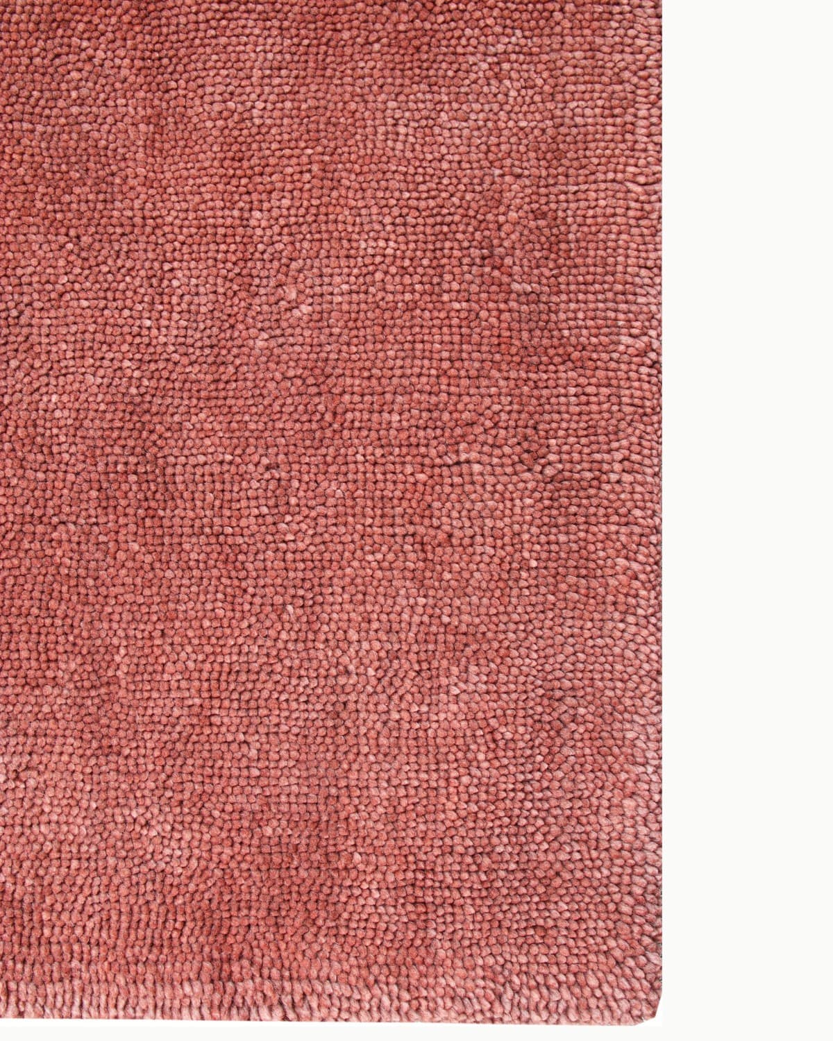 Close up lay-flat corner edge showcasing the dense, handcrafted structure of the felted natural fibres.