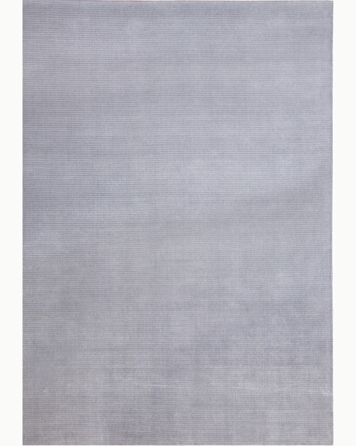House of Bohi Shafi area rug in silver grey. Premium New Zealand wool handloomed with a structured linear texture.