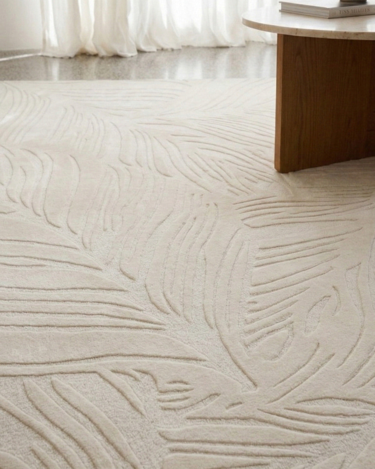 Close up of the dense, tactile finish inspired by the fluid drift of leaves. Beautifully catches light and shadow.