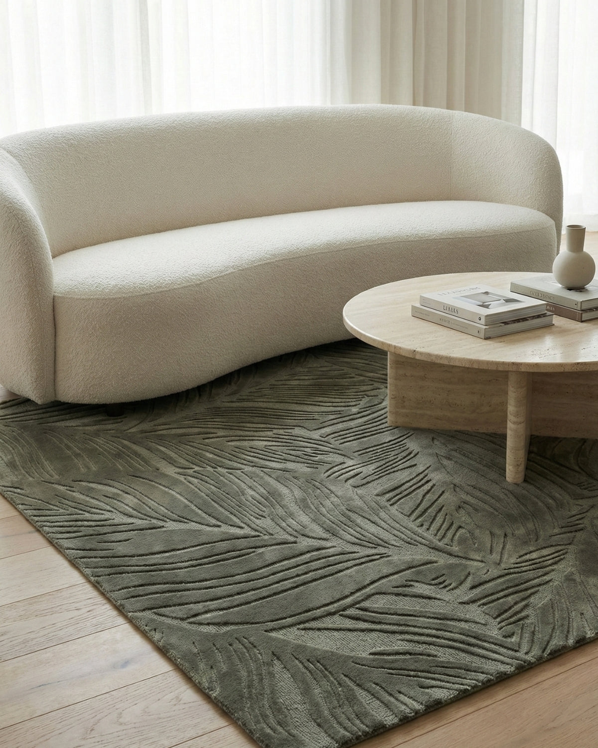 A refined statement floor covering styled in a living room. Handtufted design adds a rhythmic, organic presence to spaces.