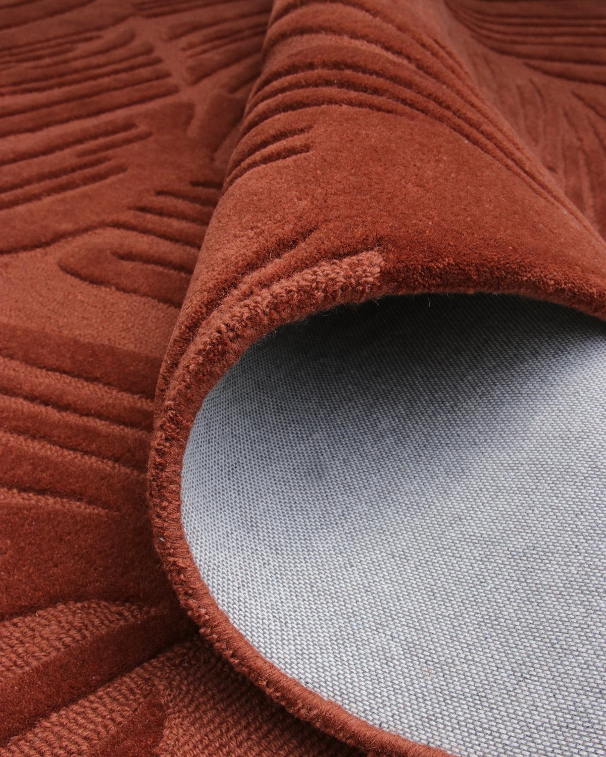 Rolled corner revealing edge finishing and backing. This ethically produced, GoodWeave certified design is ideal for bedrooms.